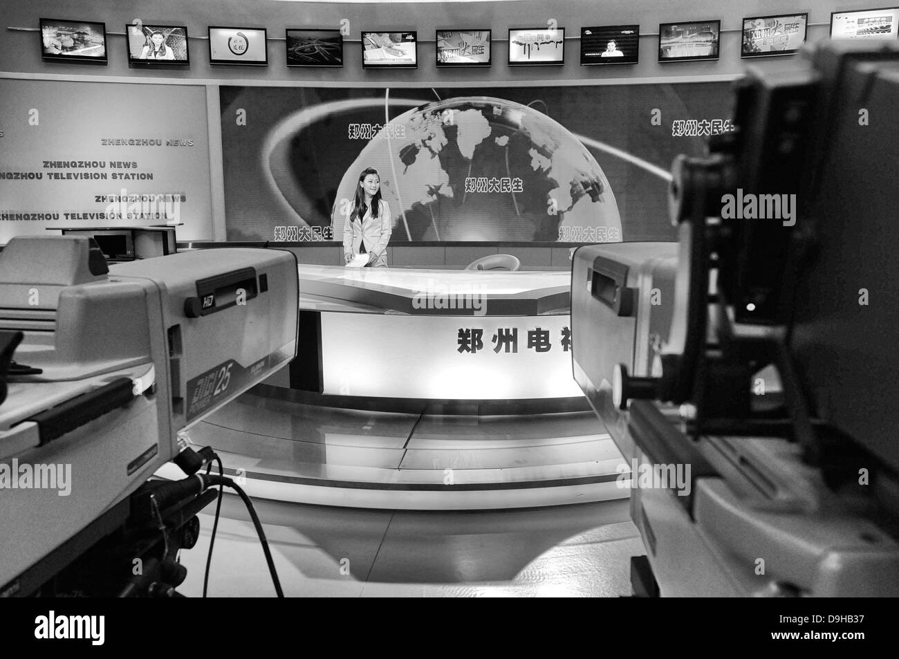 A TV newscaster delivering the news Stock Photo