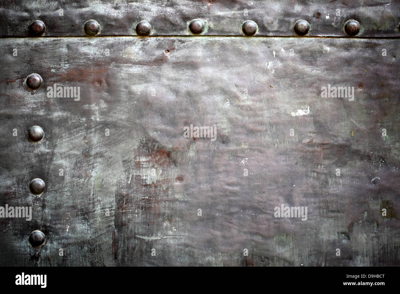 Black grunge metal plate or armour texture with rivets as background ...