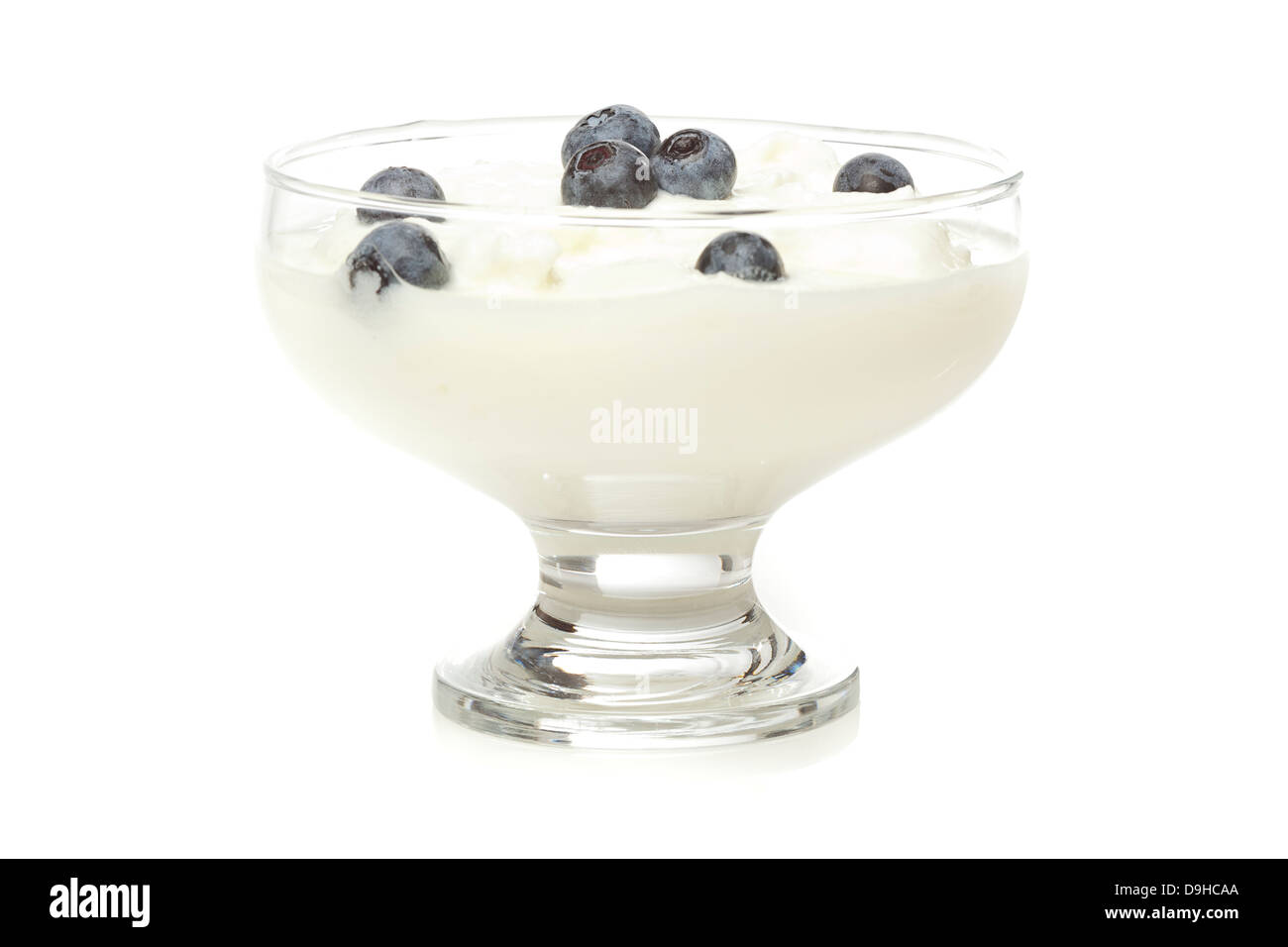 Fresh Organic Greek Yogurt with blueberries on a background Stock Photo