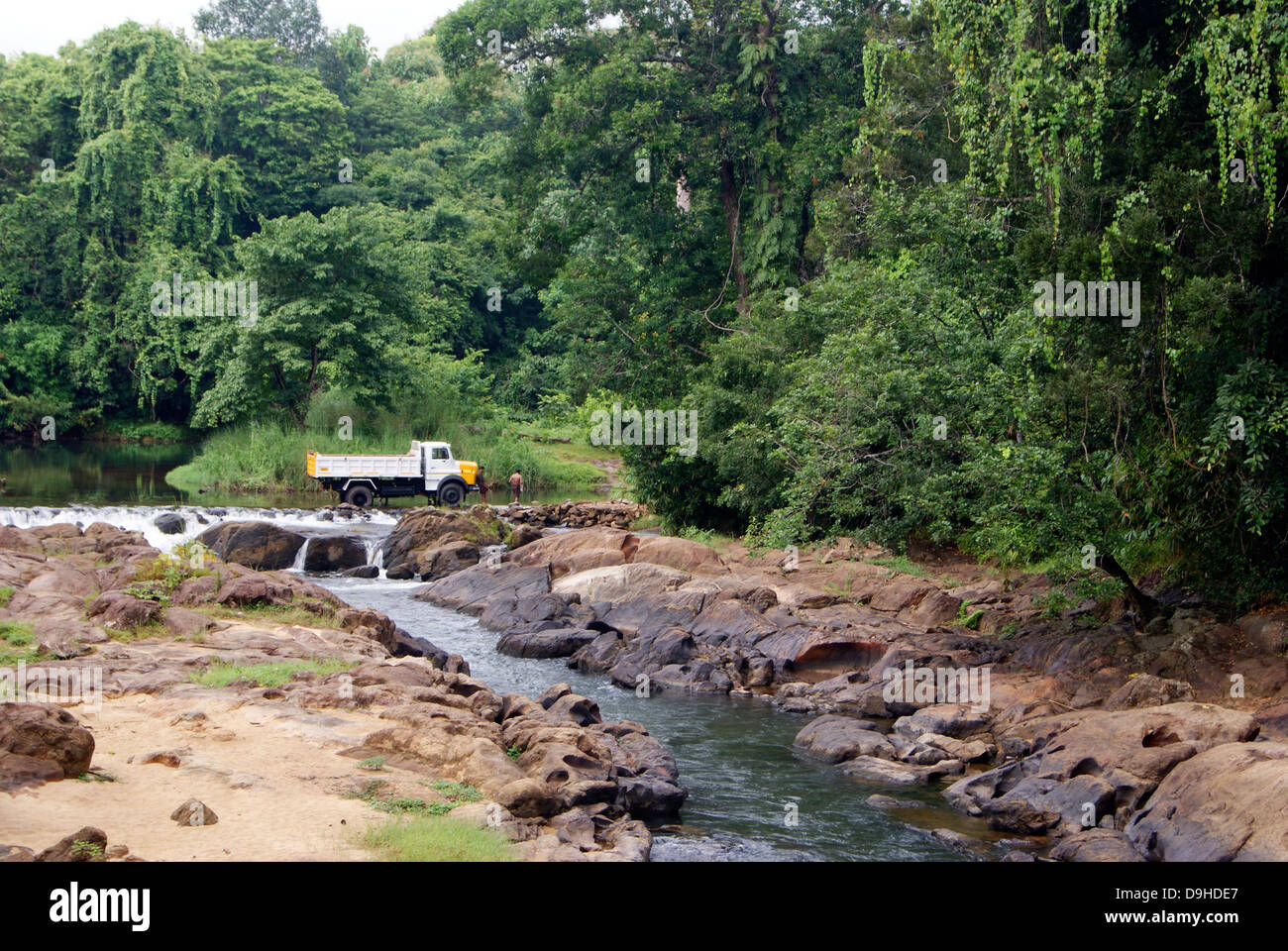 Lorry Washing in the Middle of River Stream on rural Village Outskirts at Kerala India Stock Photo