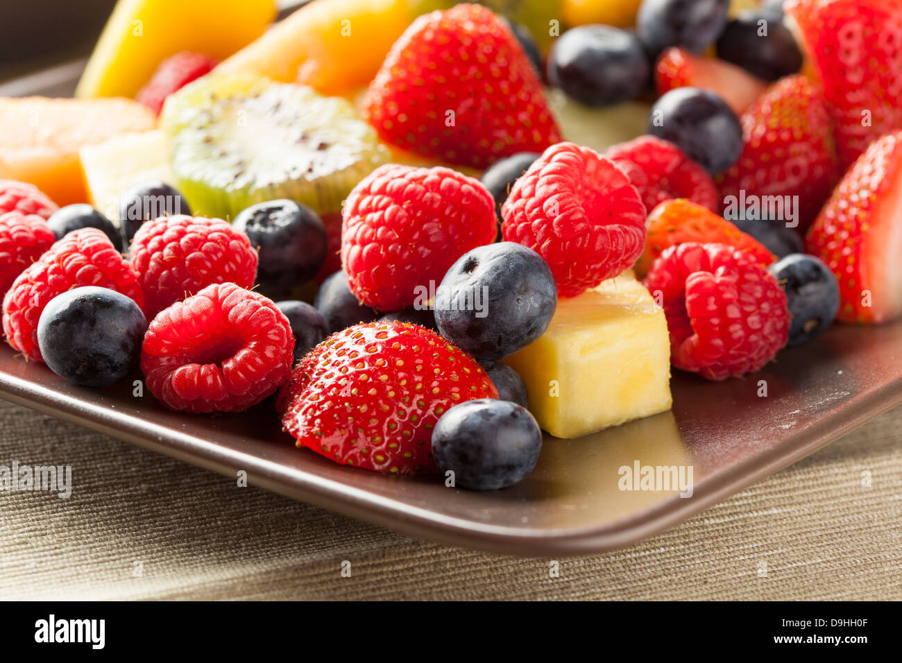 Fresh Organic Fruit Salad on a plate Stock Photo