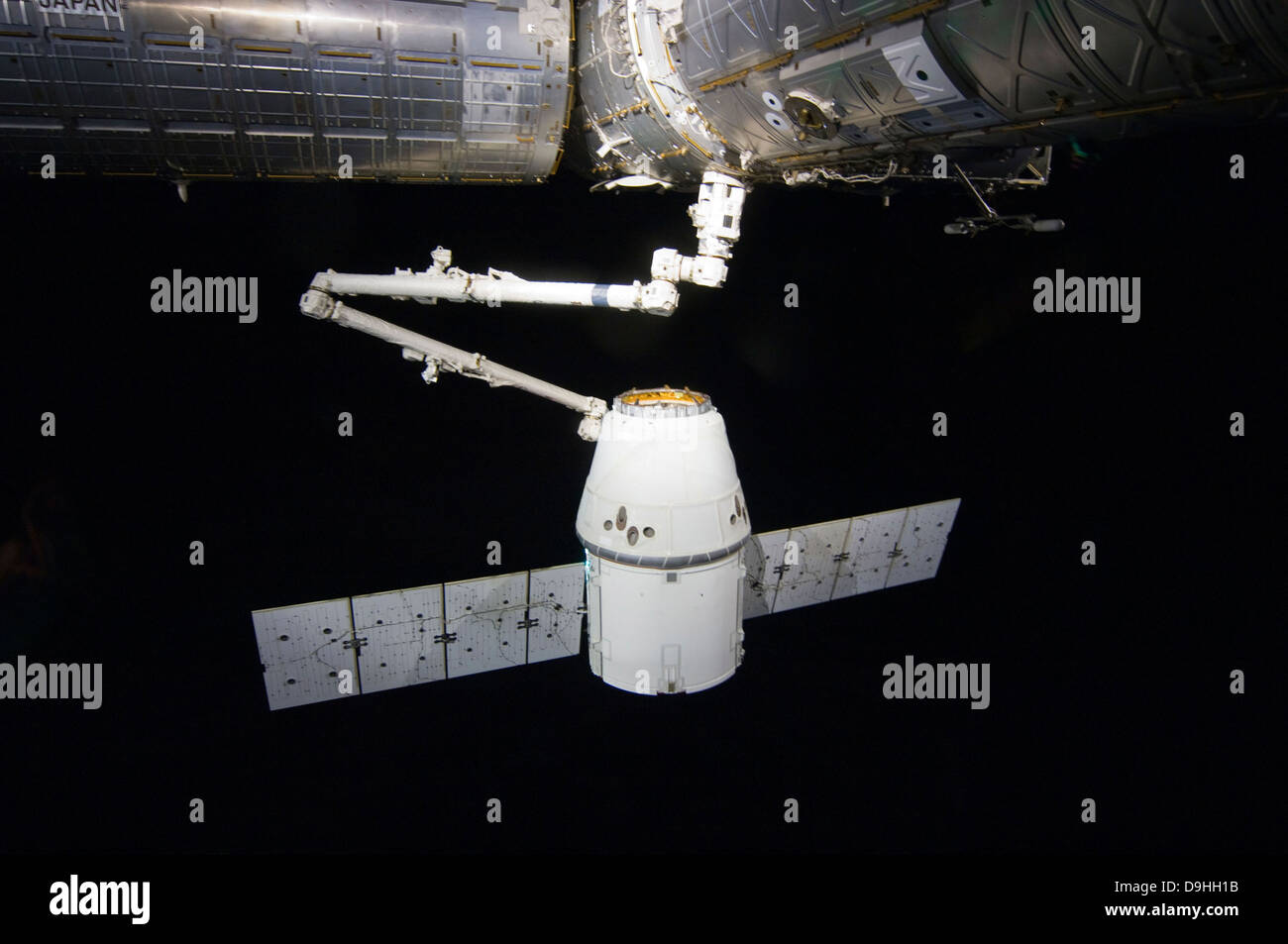 The SpaceX Dragon cargo craft prior to being released from the Canadarm2. Stock Photo