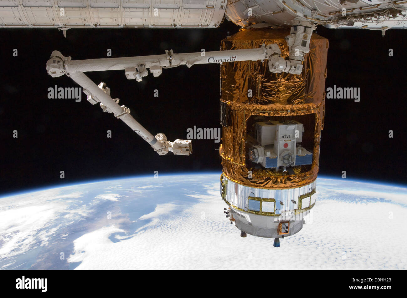 The Japanese H Ii Transfer Vehicle In The Grasp Of Canadarm2 Stock Photo Alamy