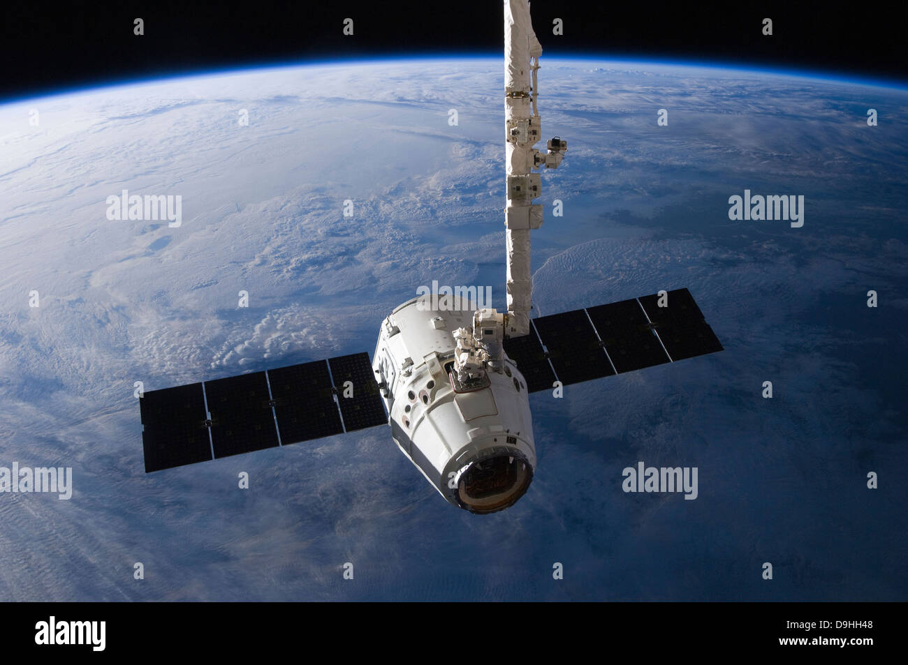 The SpaceX Dragon cargo craft prior to being released from the Canadarm2. Stock Photo