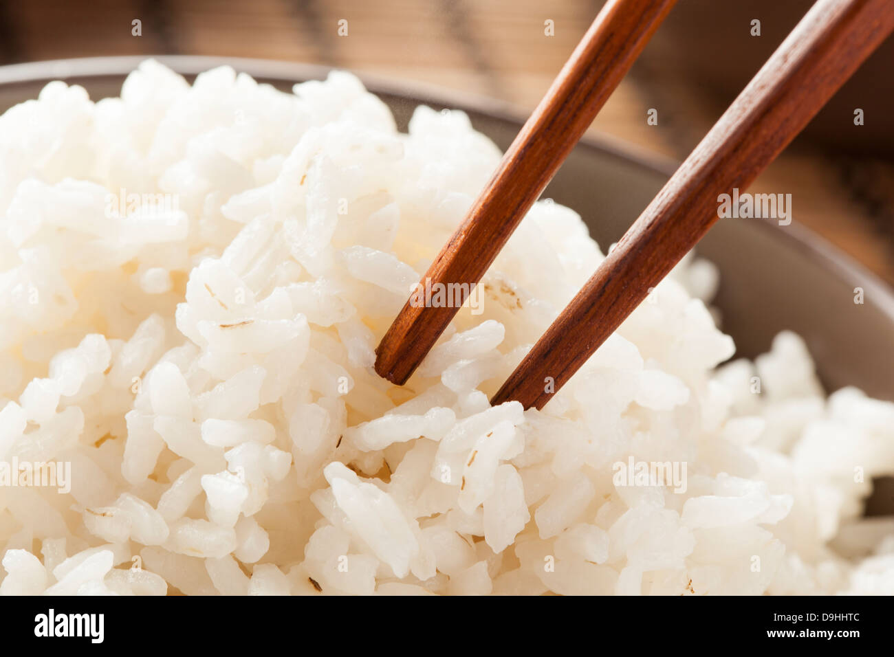Bowl of Organic White Rice with chop sticks Stock Photo Alamy