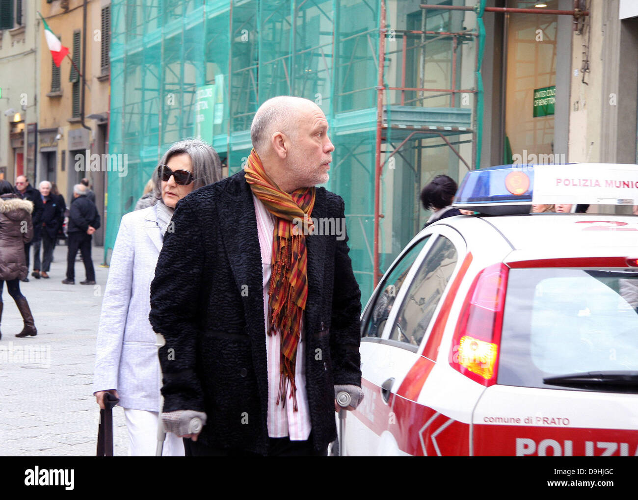Actor John Malkovich on crutches while out and about in Prato Tuscany