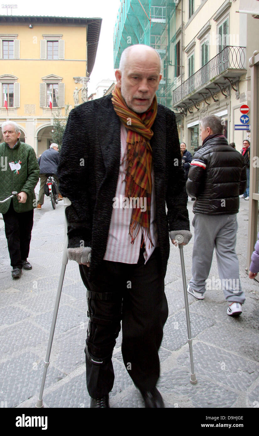 Actor John Malkovich on crutches while out and about in Prato Tuscany