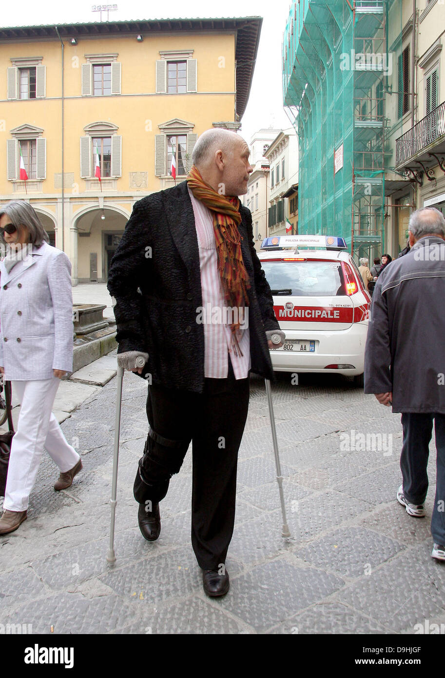 Actor John Malkovich on crutches while out and about in Prato Tuscany