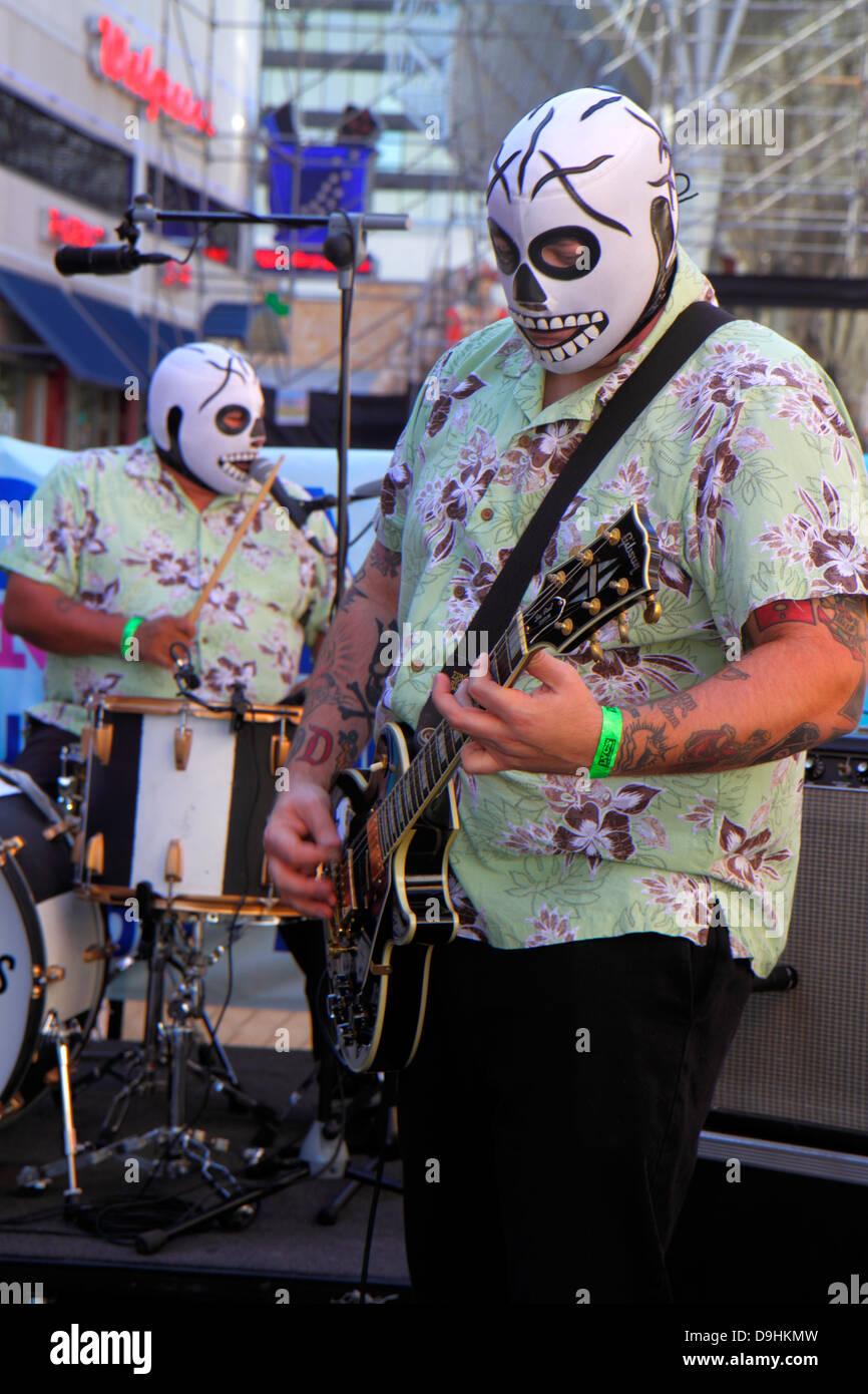 Las Vegas Nevada,Downtown,Fremont Street Experience,The Fink Bombs,rock & roll,band,skull,masks,free entertainment,electric guitar,drums,musician,NV13 Stock Photo