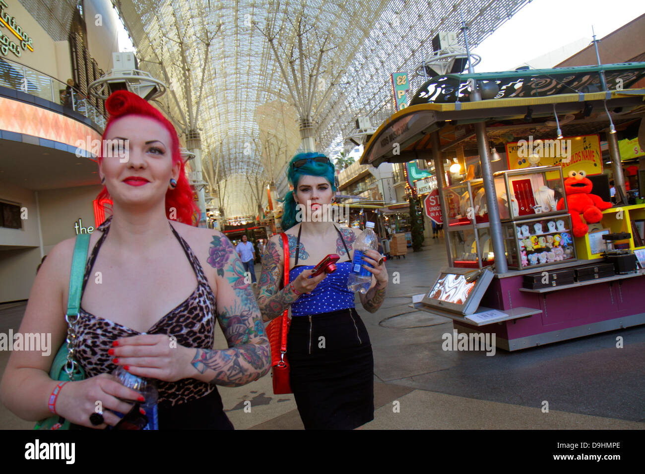 Las Vegas Nevada,Downtown,Fremont Street Experience,pedestrian mall arcade,adult adults woman women female lady,dyed hair,red,blue,tattoos,retro look, Stock Photo