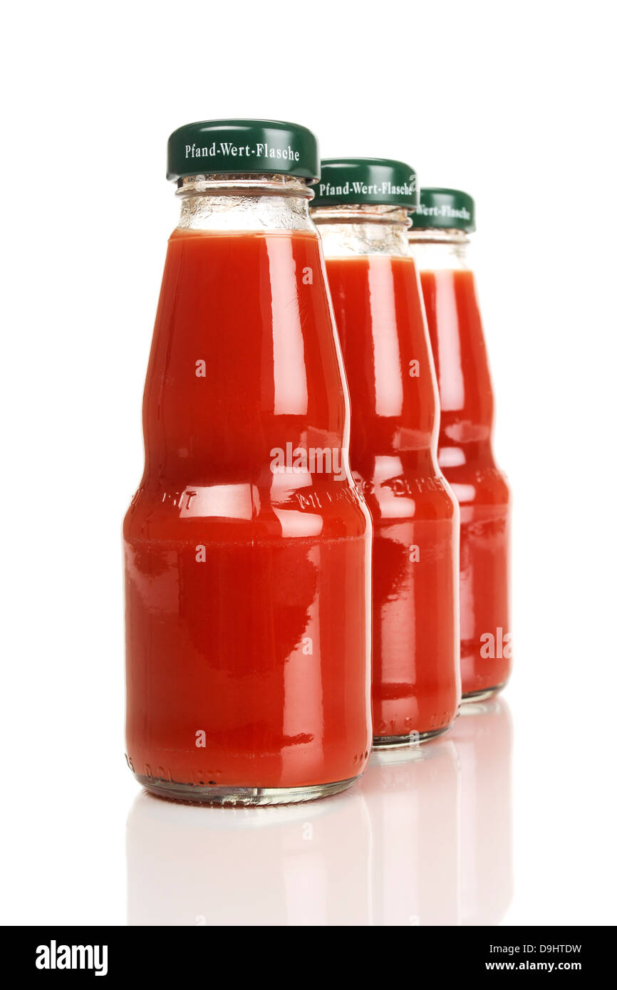 Bottles with tomato juice Stock Photo Alamy