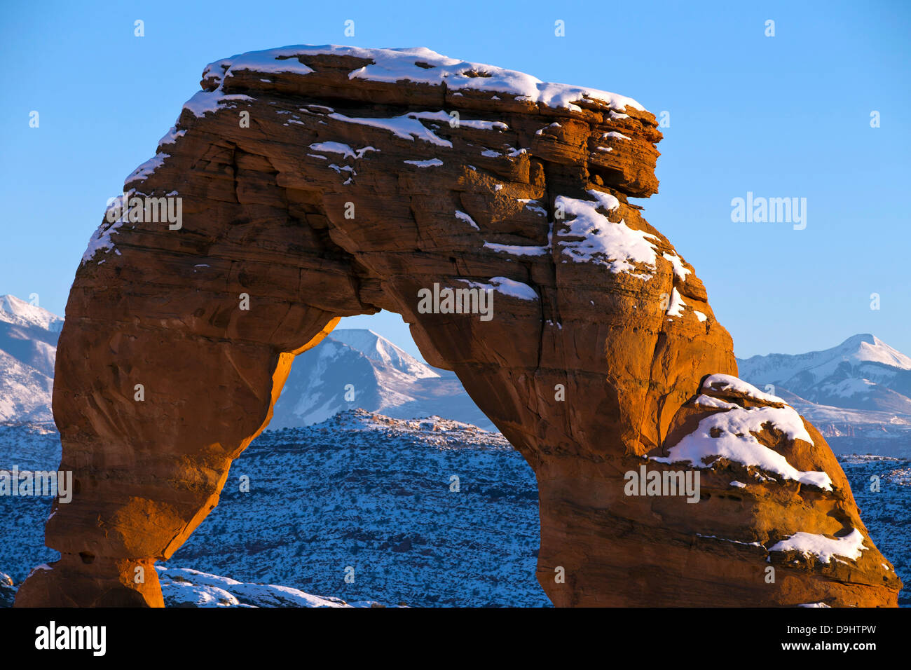 Detailed view of Delicate Arch with snow in winter at sunset, Arches National Park, Utah, United States of America Stock Photo
