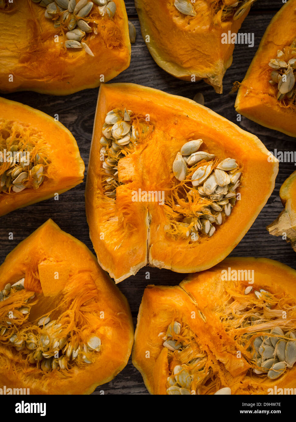 Raw pumpkin on a wooden table. Stock Photo