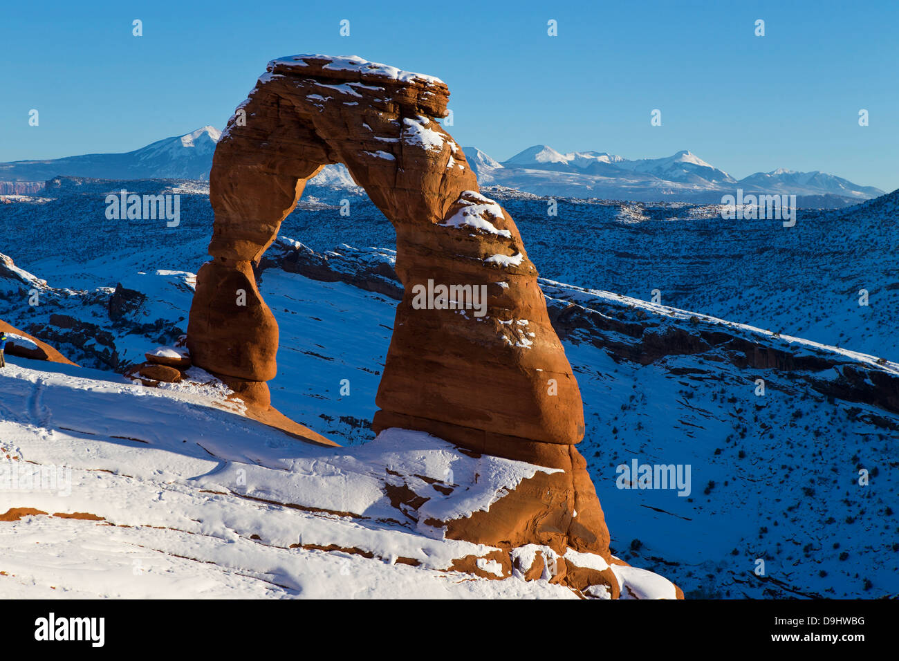 Delicate Arch with snow in winter at sunset, Arches National Park, Utah, United States of America Stock Photo