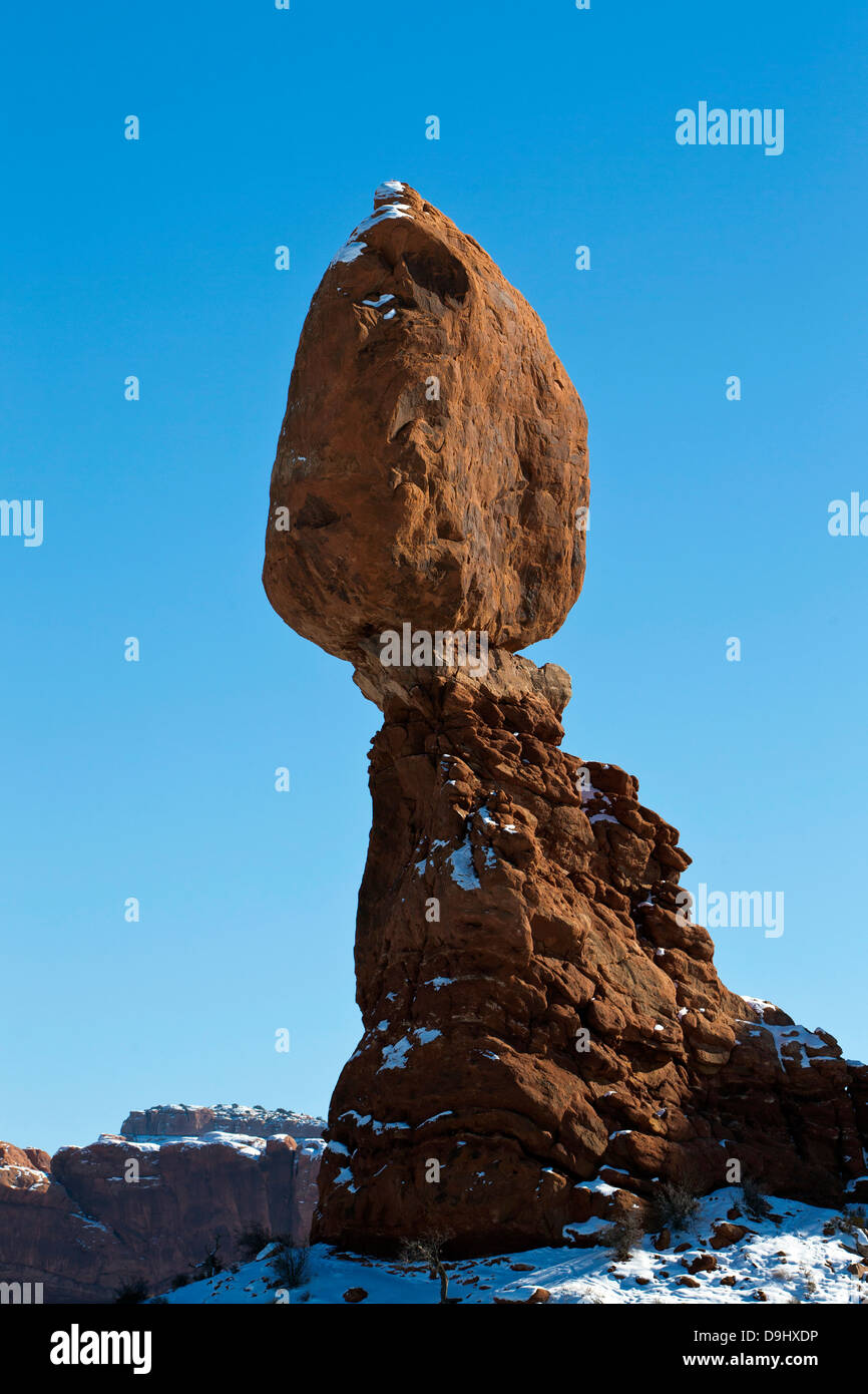 Balanced Rock during a winter morning with snow on the ground, Arches National Park, Utah, United States of America Stock Photo