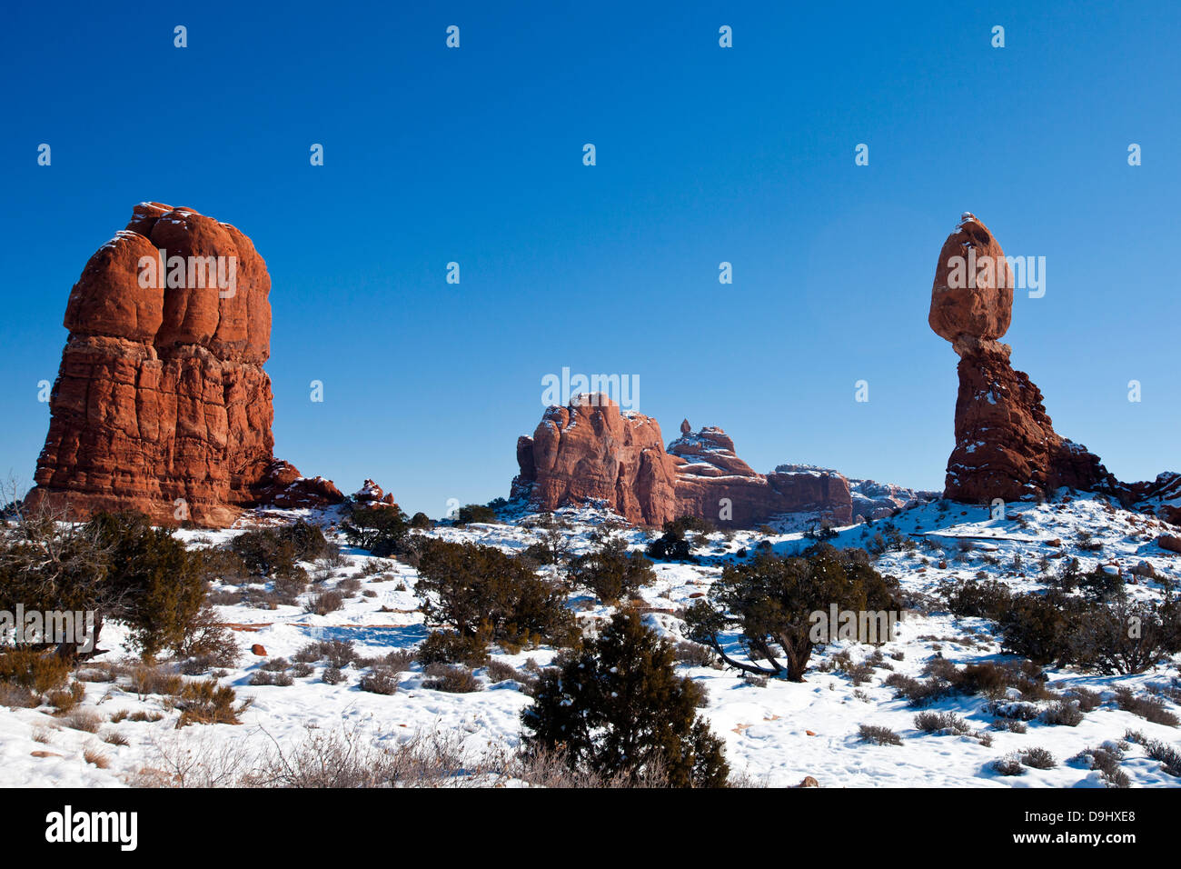 Balanced Rock during a winter morning with snow on the ground, Arches National Park, Utah, United States of America Stock Photo