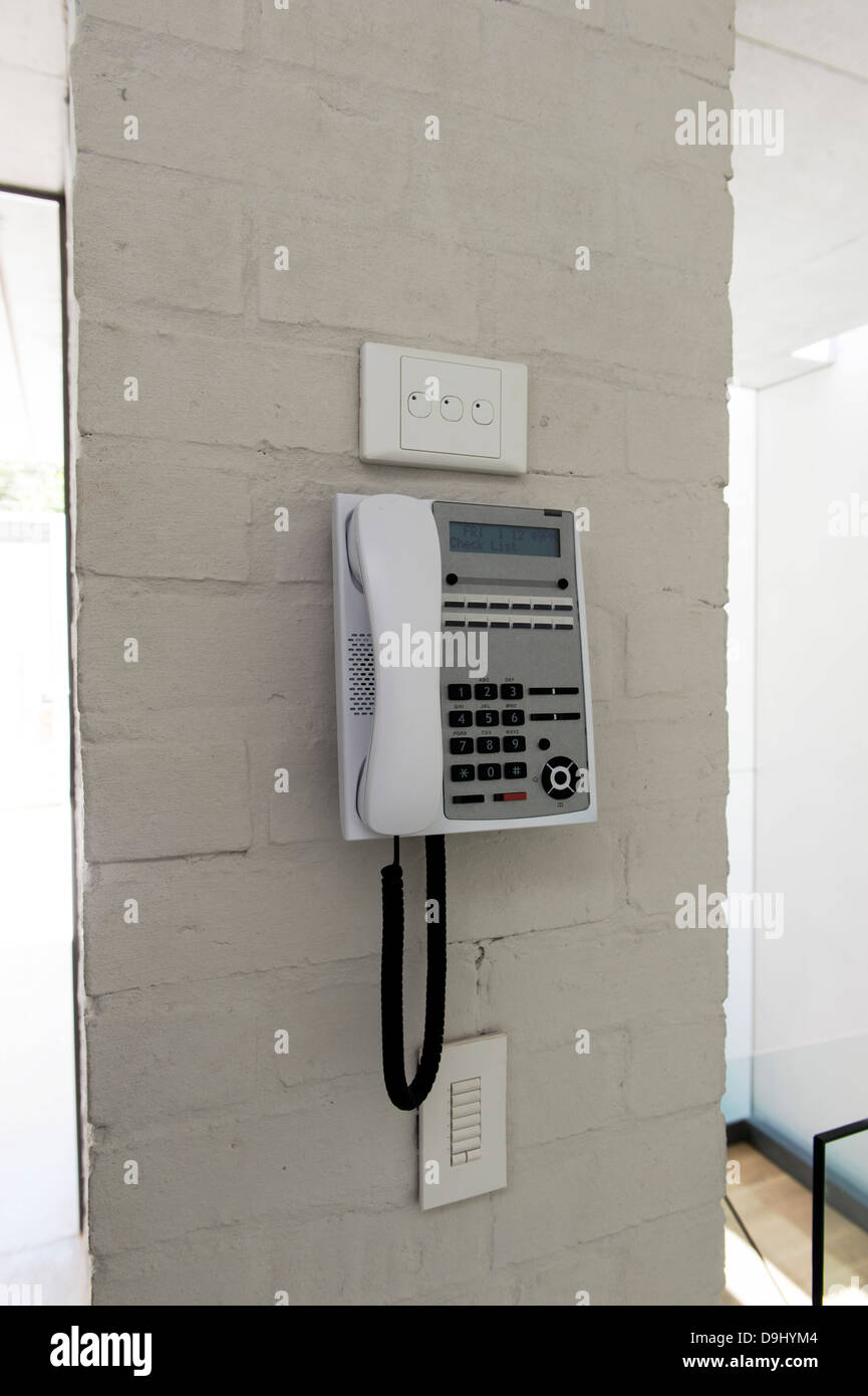 Telephone mounted on a wall Stock Photo Alamy