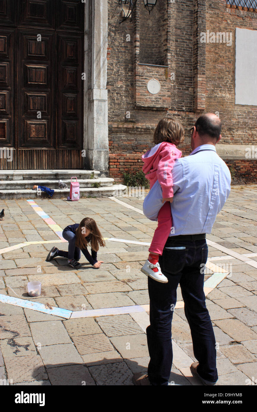 Family street scene in Venice Stock Photo