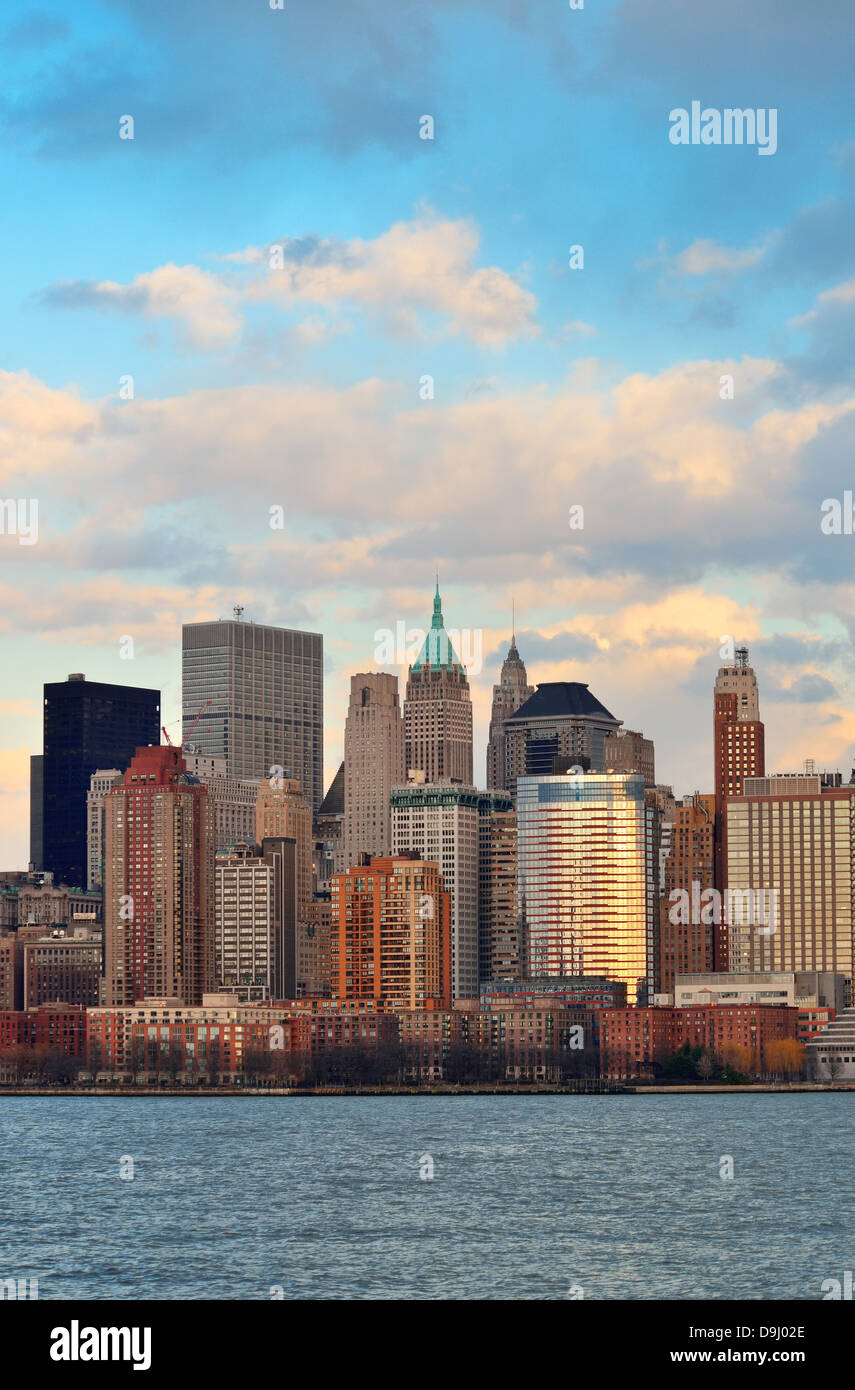 Downtown Manhattan skyline at sunset over Hudson River in New York City ...
