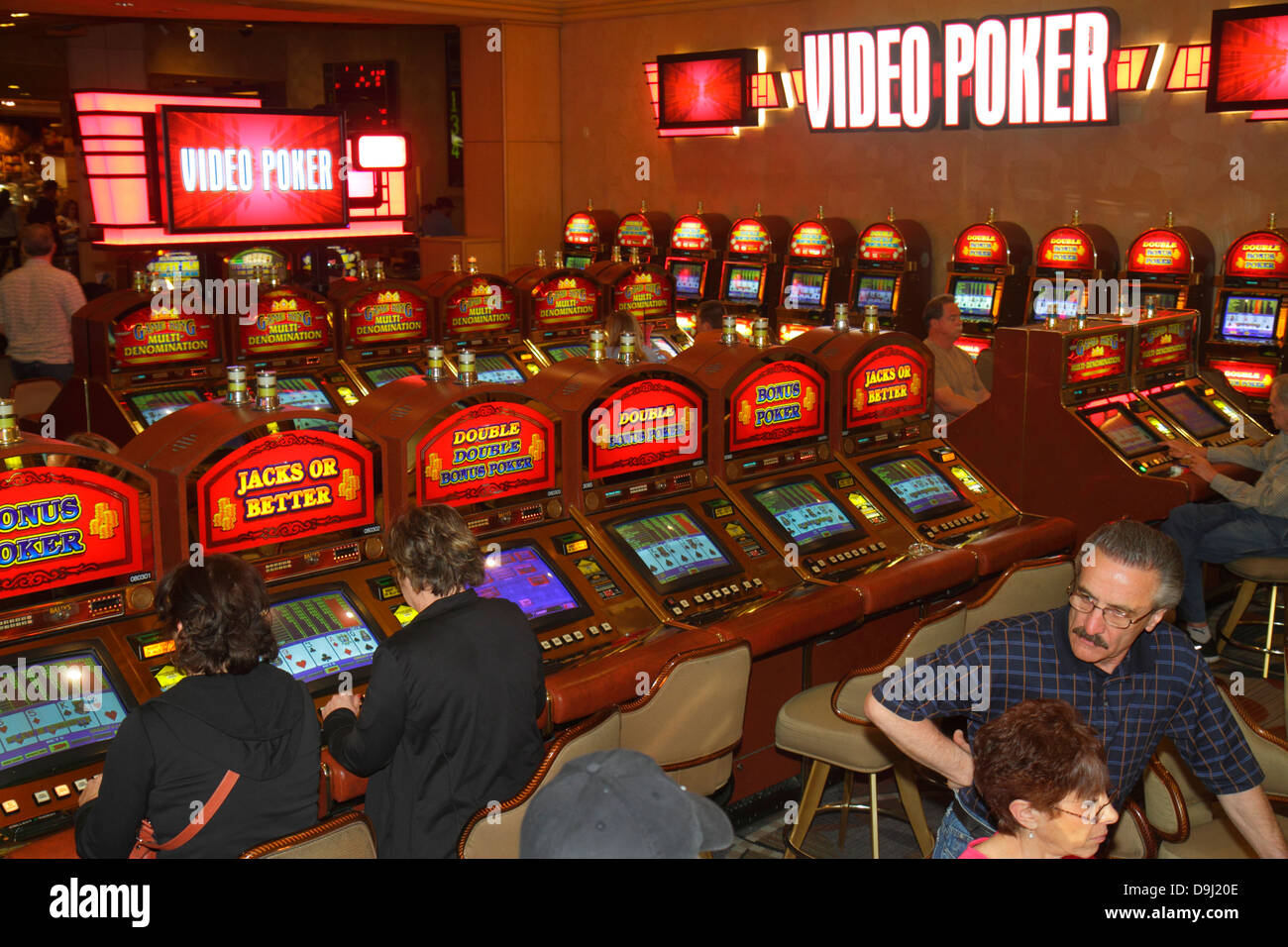 Las Vegas Nevada,The Strip,South Las Vegas Boulevard,Bally's Las Vegas Hotel & Casino,gamble,gambling,gamblers,players,video poker,NV130330025 Stock Photo
