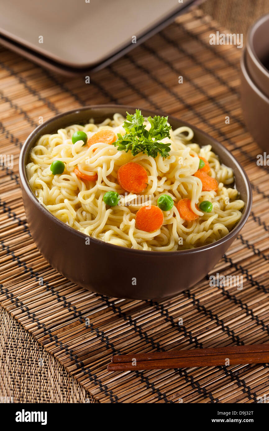 Homemade Quick Ramen Noodles with carrots and peas Stock Photo Alamy
