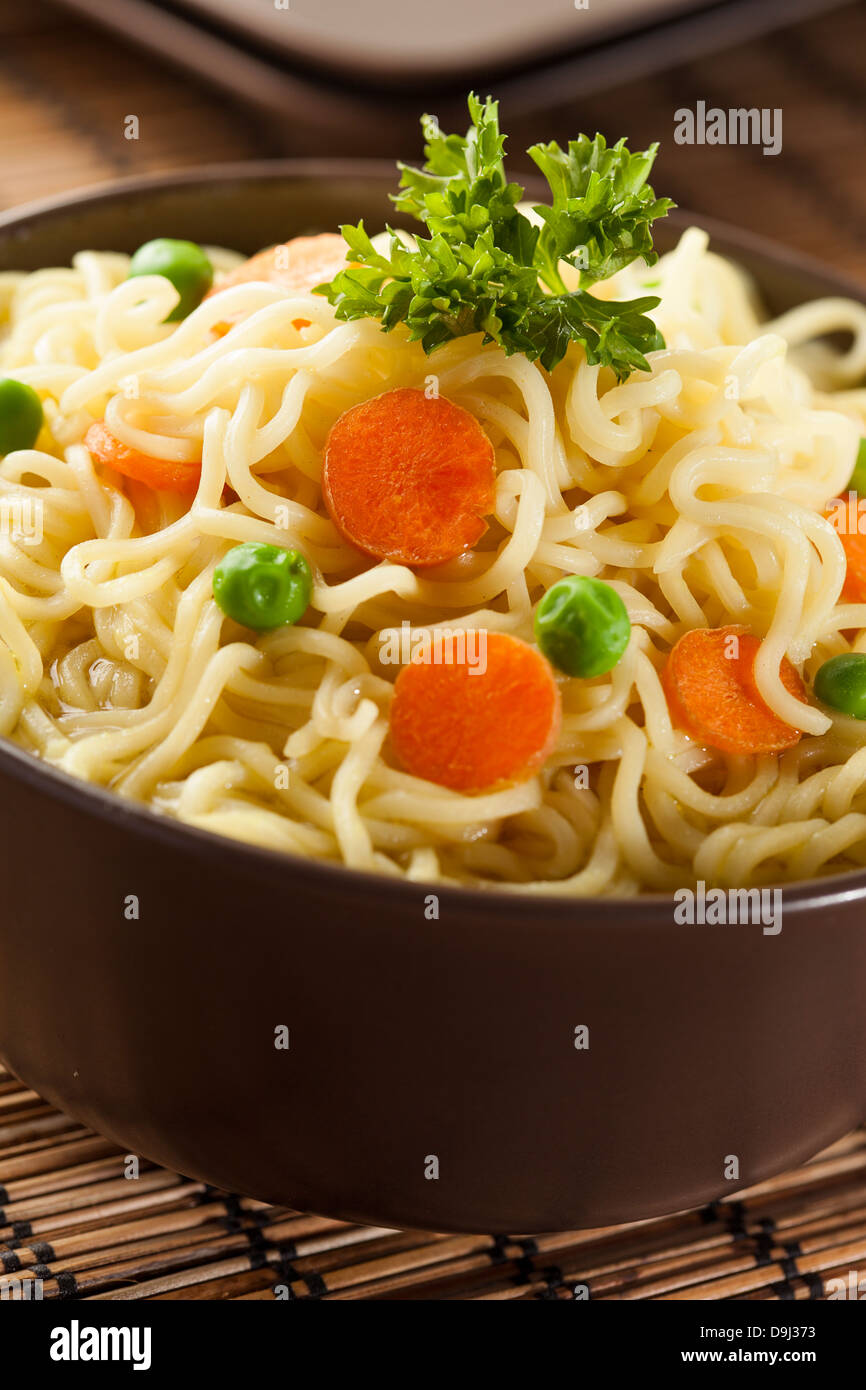 Homemade Quick Ramen Noodles with carrots and peas Stock Photo - Alamy