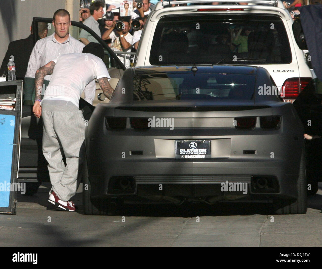 David Beckham Hunches Over His Platinum Motorsport Sports Car As