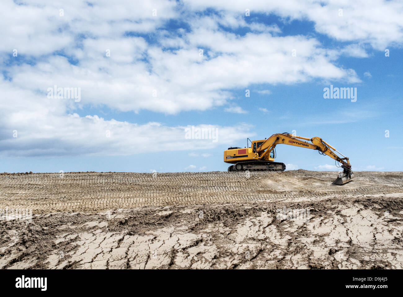 Excavator with the diking Stock Photo