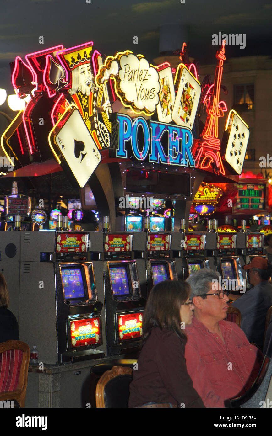 Las Vegas Nevada,The Strip,South Las Vegas Boulevard,Paris Las Vegas Hotel  and Casino,video poker,gamble,gambling,gambler,adult adults man men male,wo  Stock Photo - Alamy