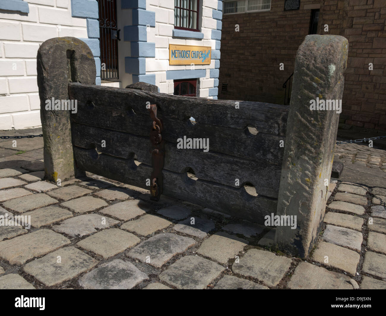Old 18th century  wooden stocks in Chapel-en-le-Frith  a small town  in Derbyshire, England Stock Photo