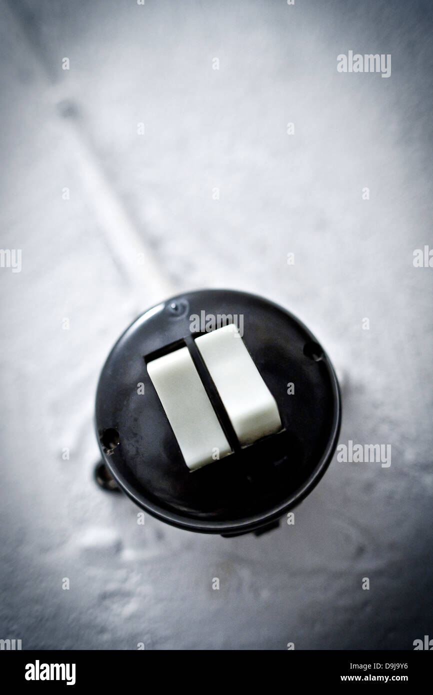 Old light switch in a cellar rising, Old light switch in a basement stairway Stock Photo