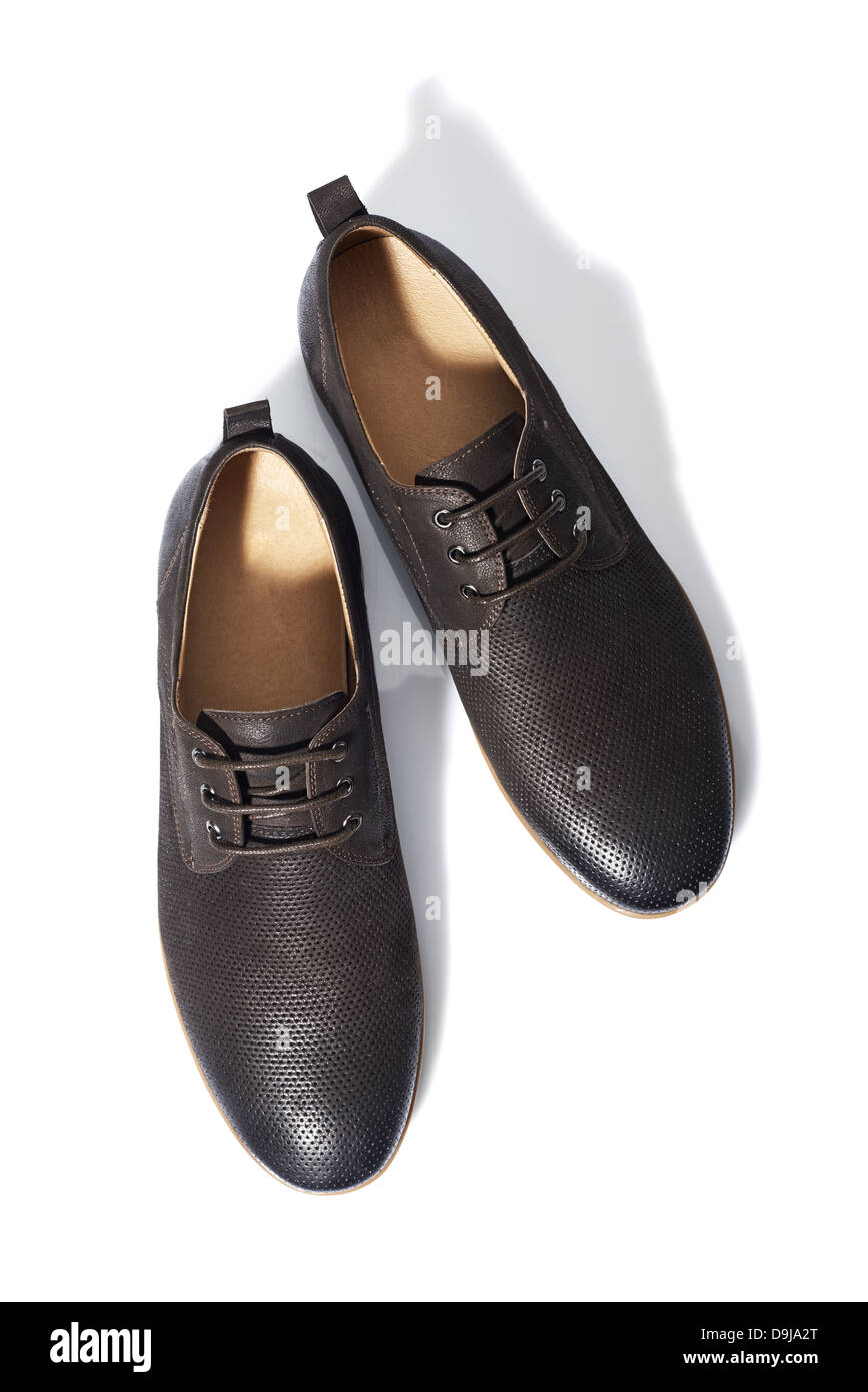 Studio shot of brown mens shoes on white background Stock Photo - Alamy