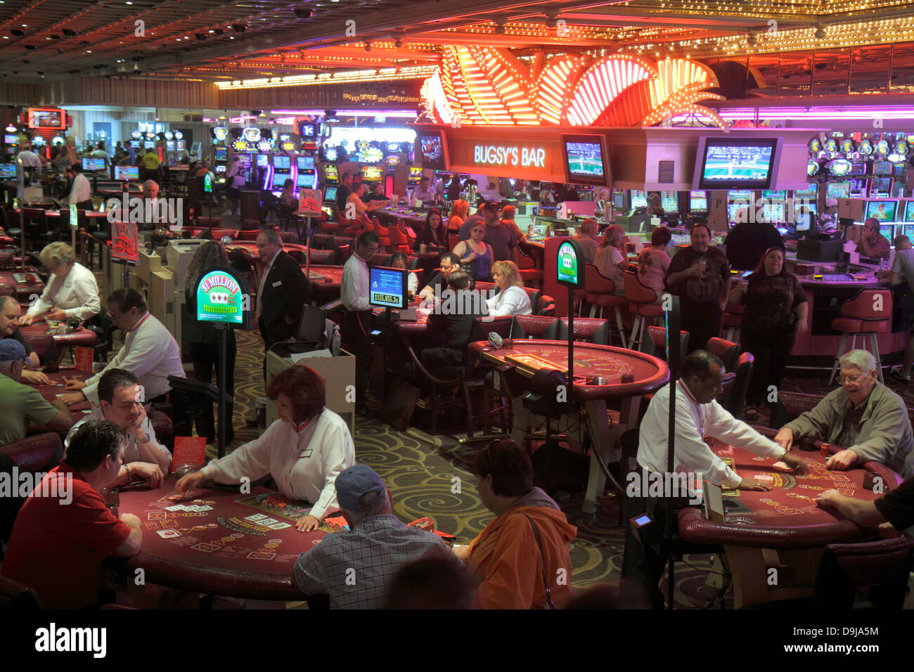 Las Vegas Nevada,The Strip,South Las Vegas Boulevard,Flamingo Las Vegas Hotel & Casino,gamblers,gamble,gambling,players,dealers,blackjack tables,bar l Stock Photo