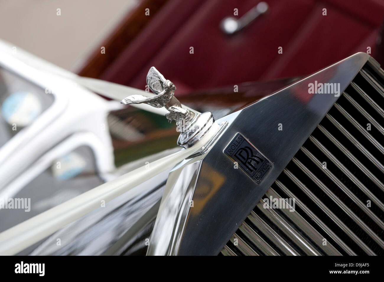 Front detail of Rolls Royce wedding car showing ribbon, grille, radiator, spirit of ecstasy emblem Stock Photo