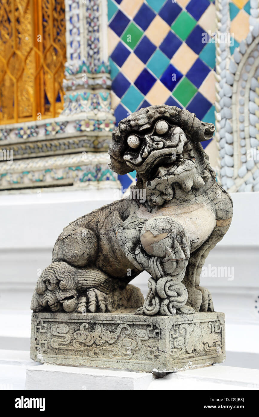 Traditional dog statue at Wat Phra Kaew, Temple of the Emerald Buddha Complex, Bangkok, Thailand Stock Photo