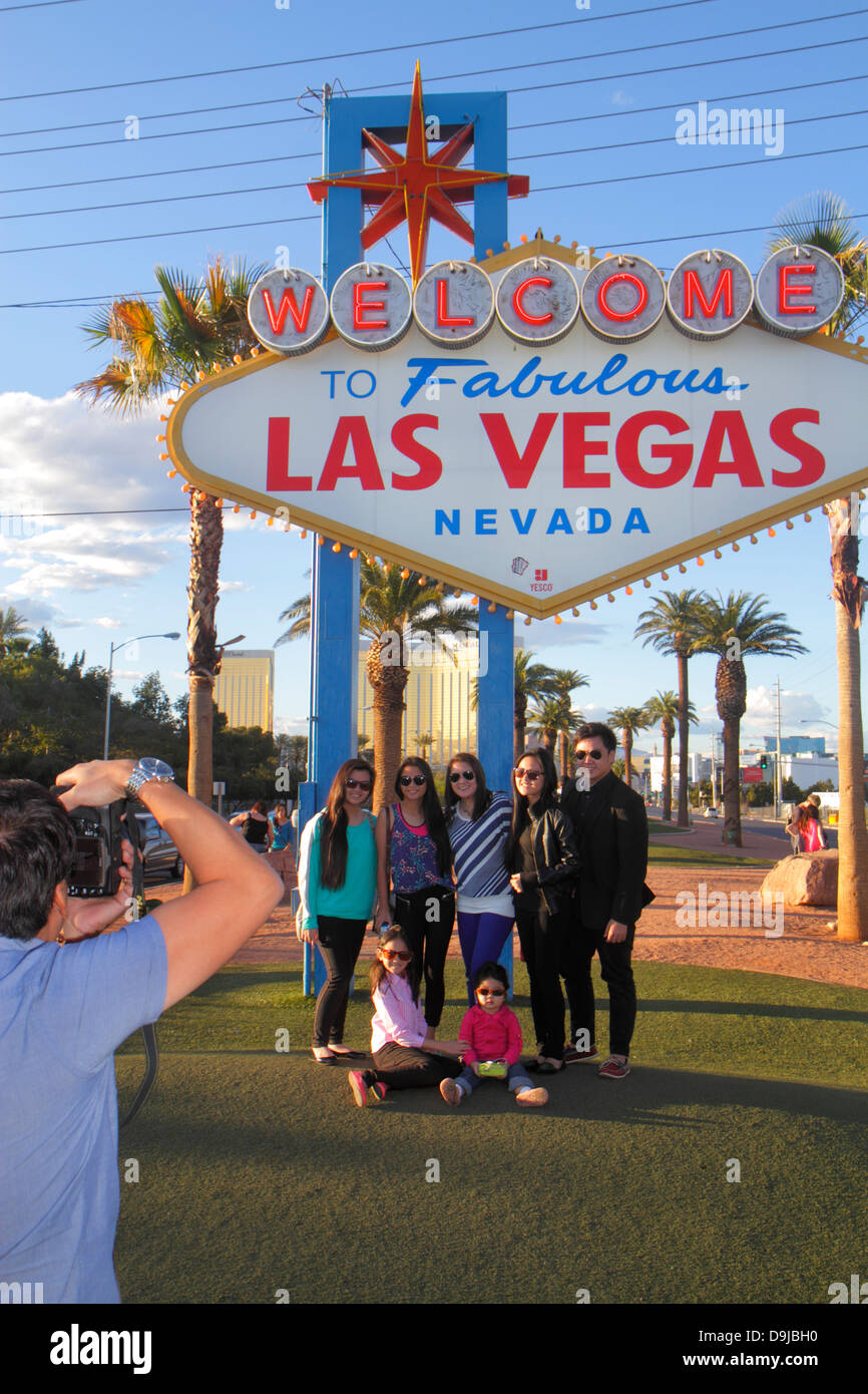 Las Vegas Nevada,South Las Vegas Boulevard,The Strip,Welcome to Fabulous Las Vegas sign historic,posing,pose,camera,digital,taking man men male,woman Stock Photo