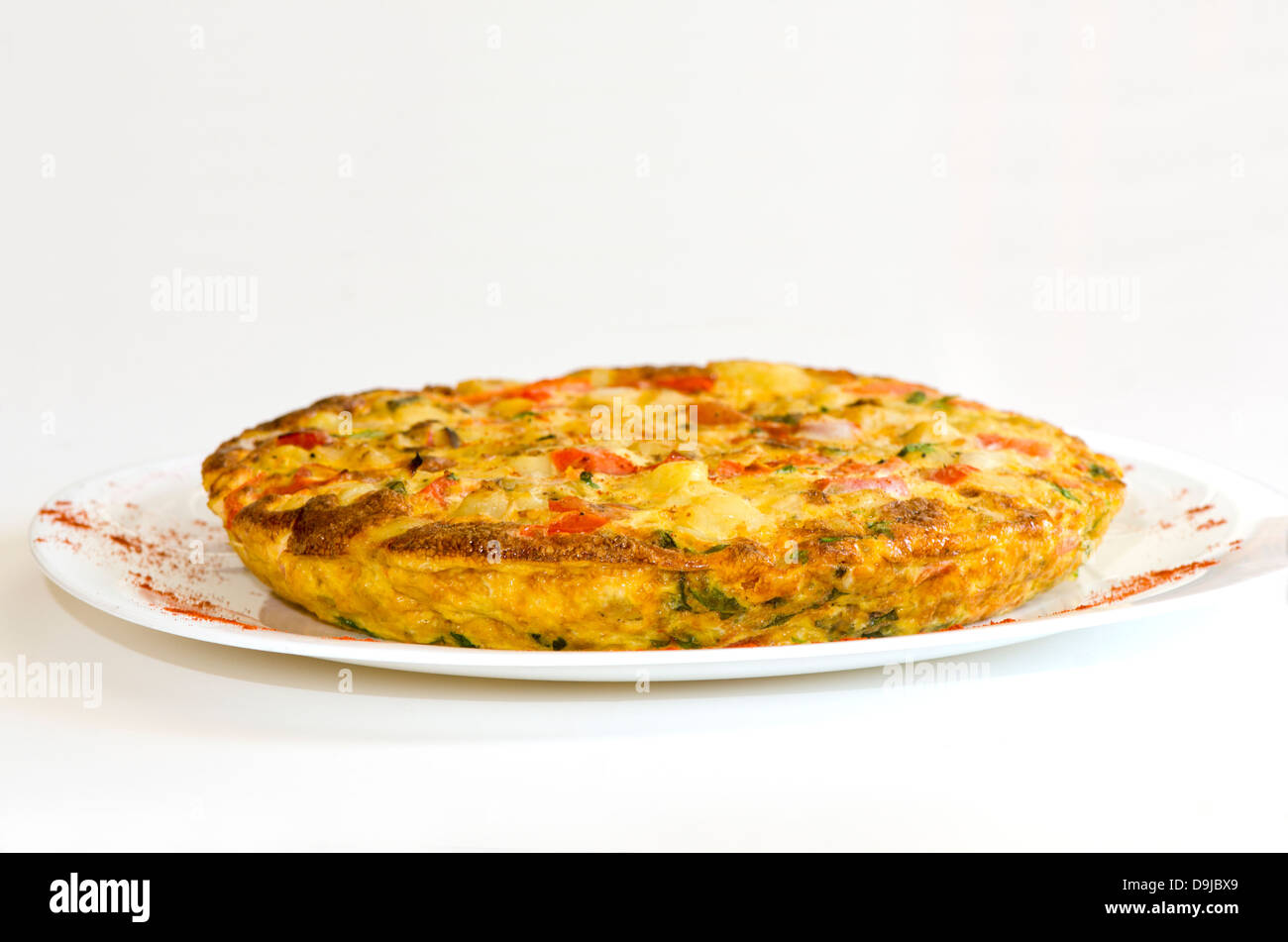 Spanish Omelette on a white plate. Andalusia, Spain. Stock Photo