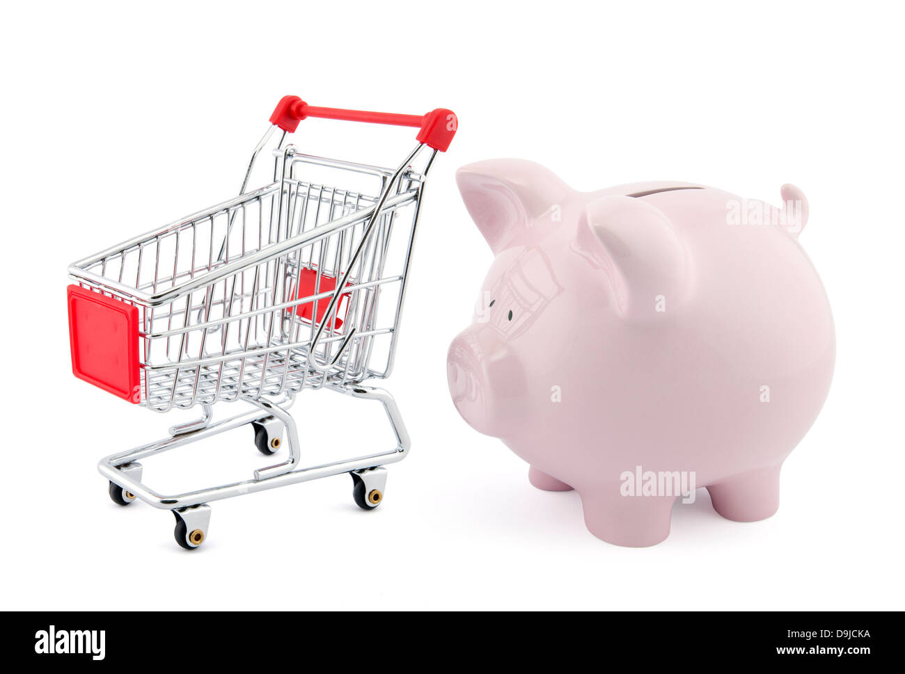 Piggy bank with shopping cart Stock Photo