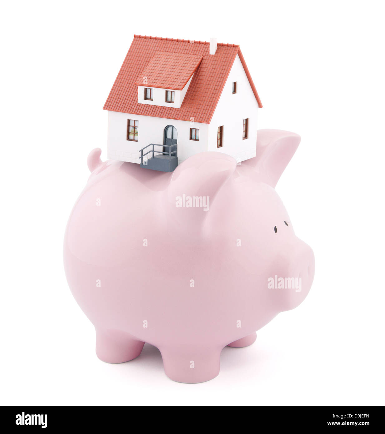 Piggy bank with small model house Stock Photo