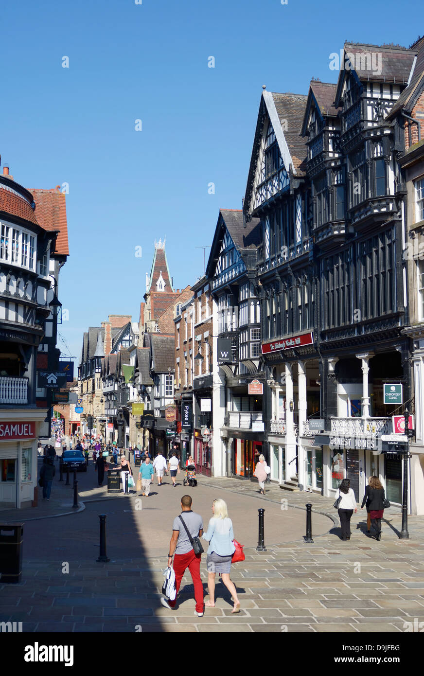 Shoppers and tourists in Eastgate Street in Chester, the administrative centre of the county of