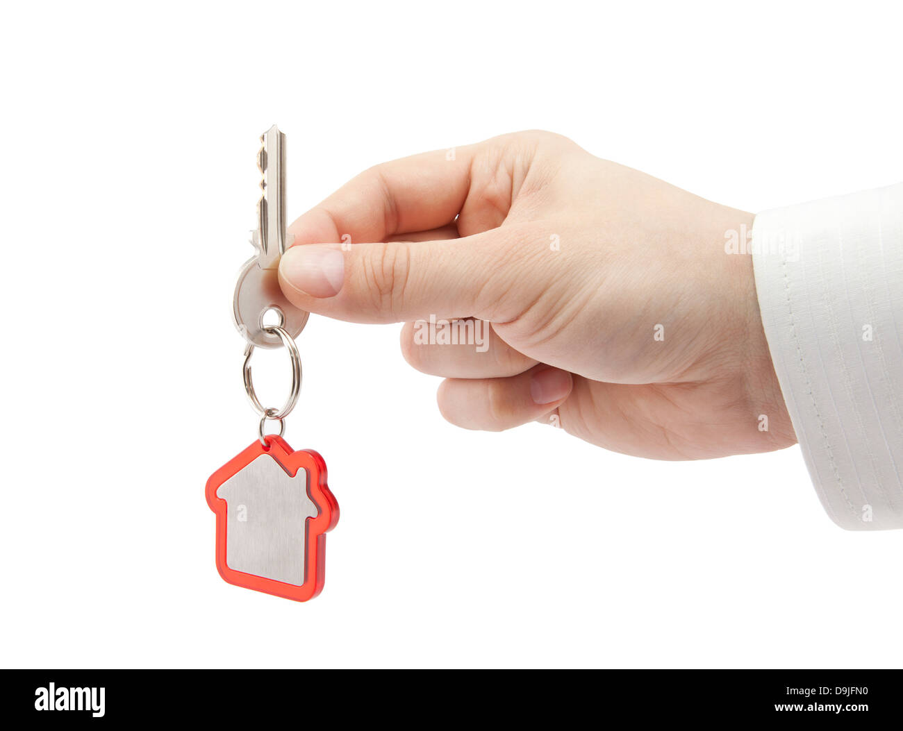House key in hand with clipping path Stock Photo