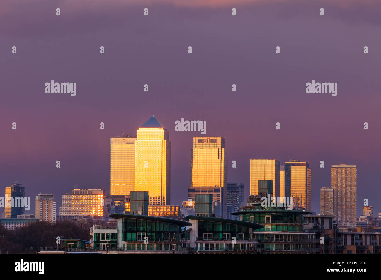 England, London, River Thames and Canary Wharf Skyline at Dusk Stock Photo