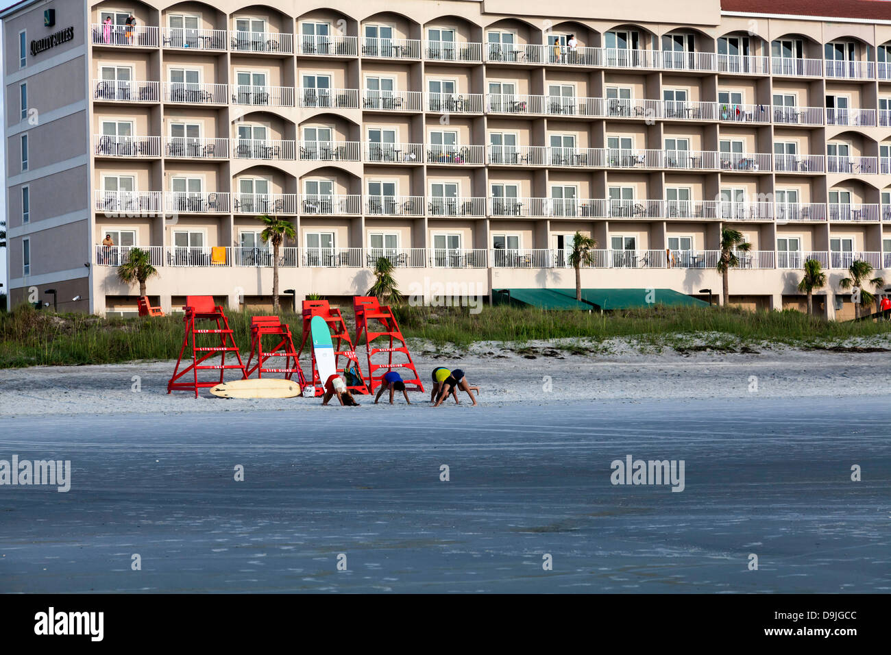 JAX Beach Paddling Challenge participants exercising on the beach in