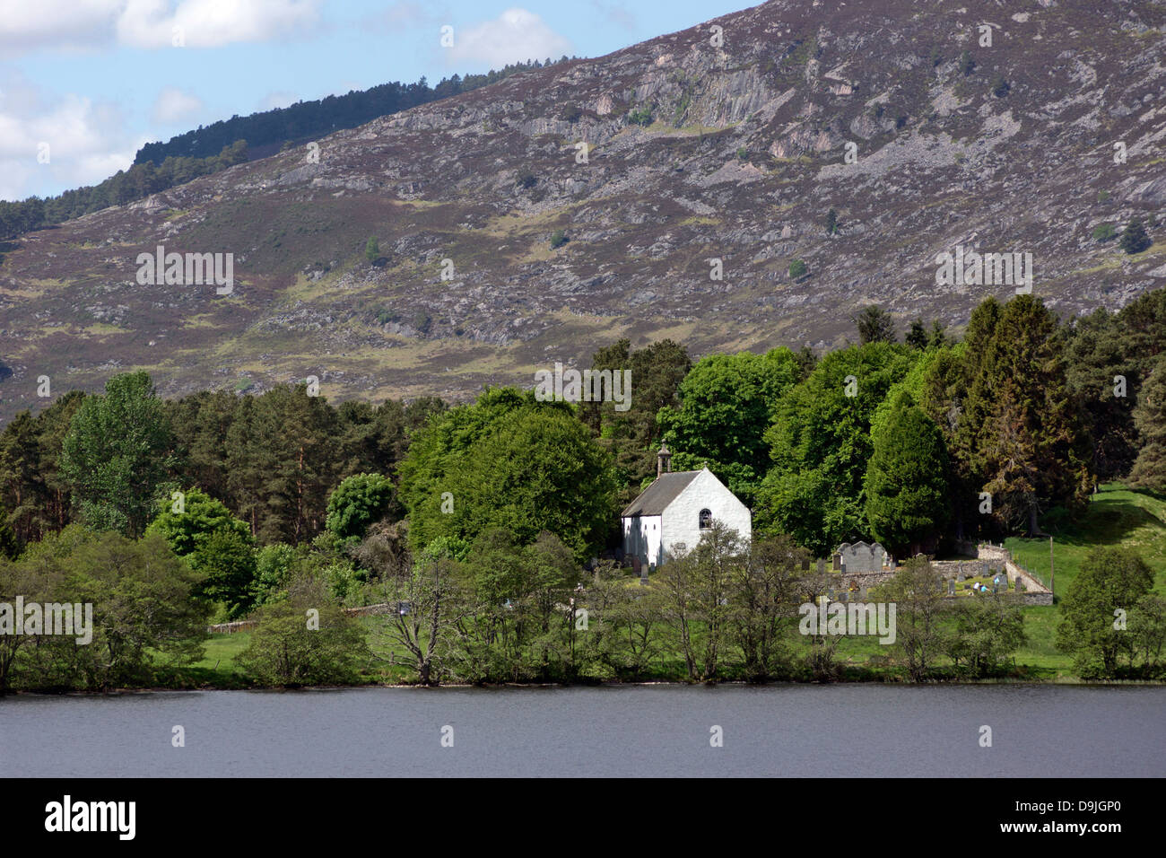 View across Loch Alvie towards Alvie Church Stock Photo