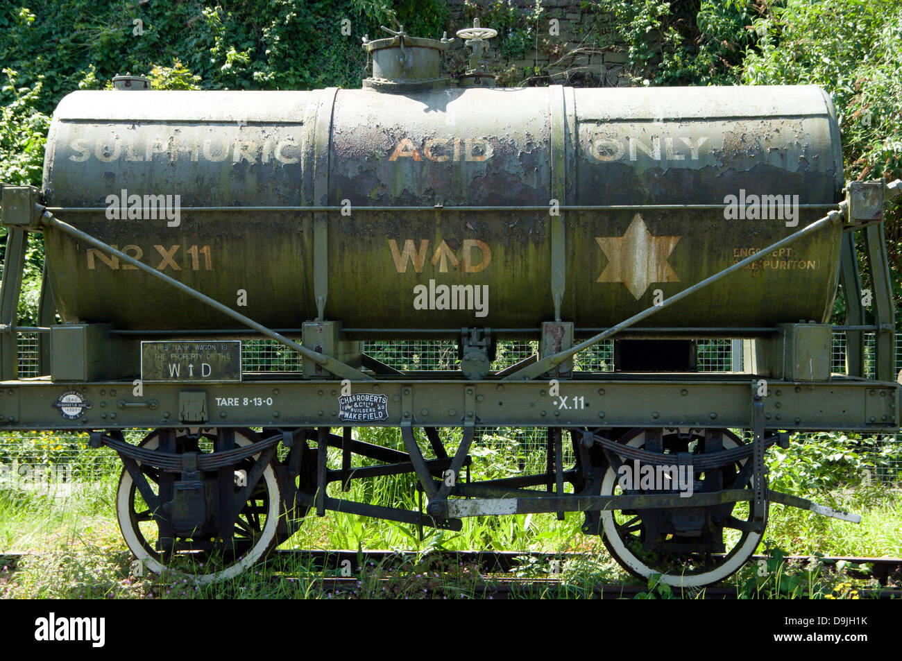 old second world war train truck for transporting sulphuric acid, besides floating harbour, bristol, england. Stock Photo