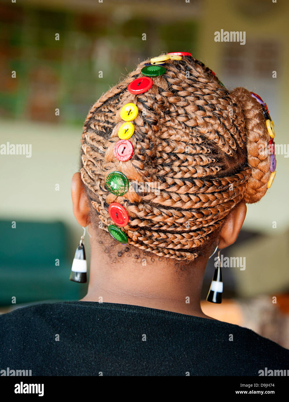 African lady wears original colorful button hat. South Africa. Stock Photo