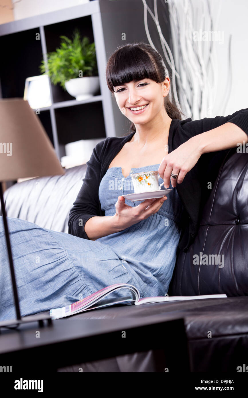 portrait of a young woman in the living room Stock Photo