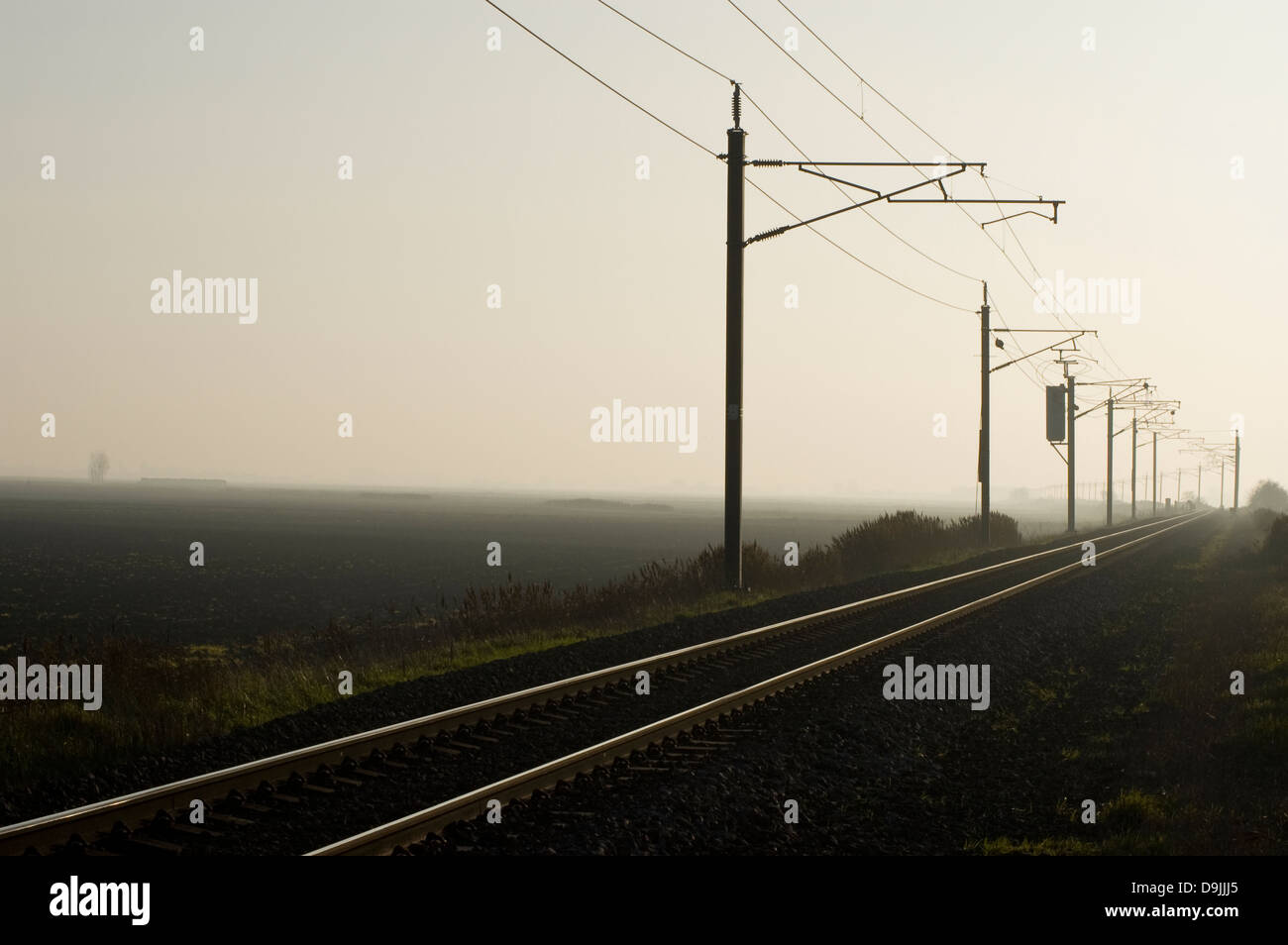 An electrified railway line in the East Anglian Fens Stock Photo
