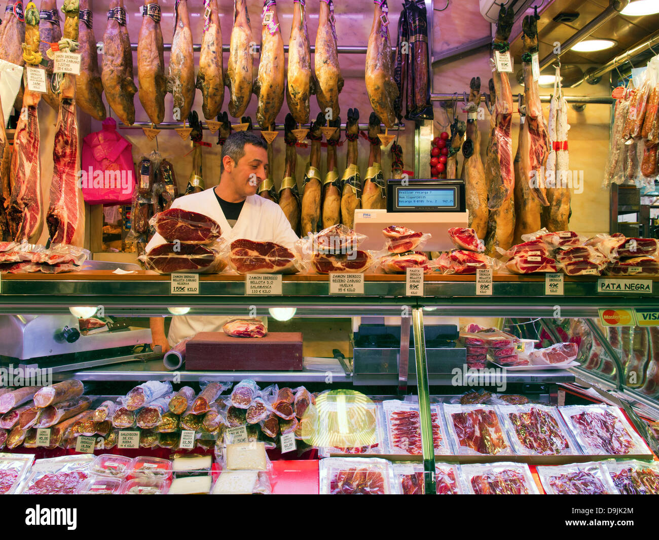 Ham and sausage shop in Boqueria Market, just off La Rambla, Barcelona, Spain Stock Photo