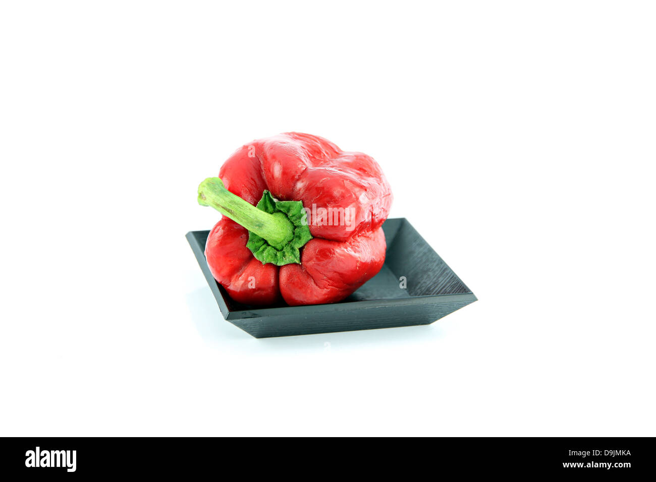 The Red Bell pepper in the black dish and Sweet pepper are high nutritional value. Stock Photo